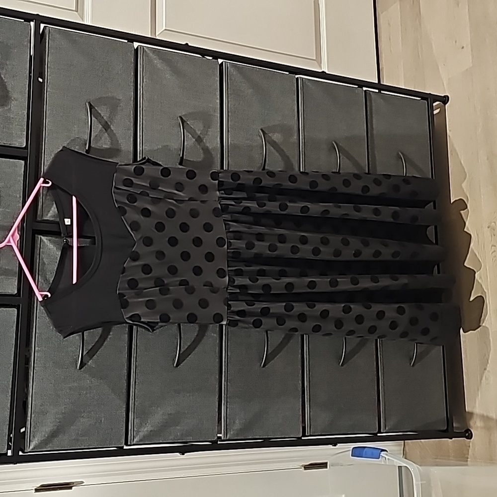 Sleeveless black polka dot dress